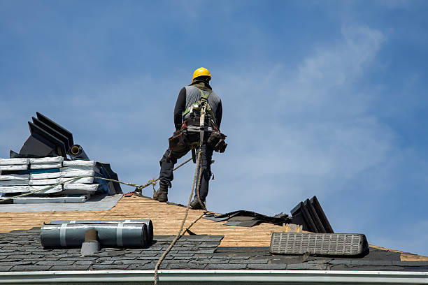 Professional Roofing technician working in Rogers, ND